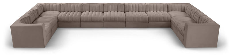 Gray modular sectional sofa with velvet-look upholstery and tufted cushions