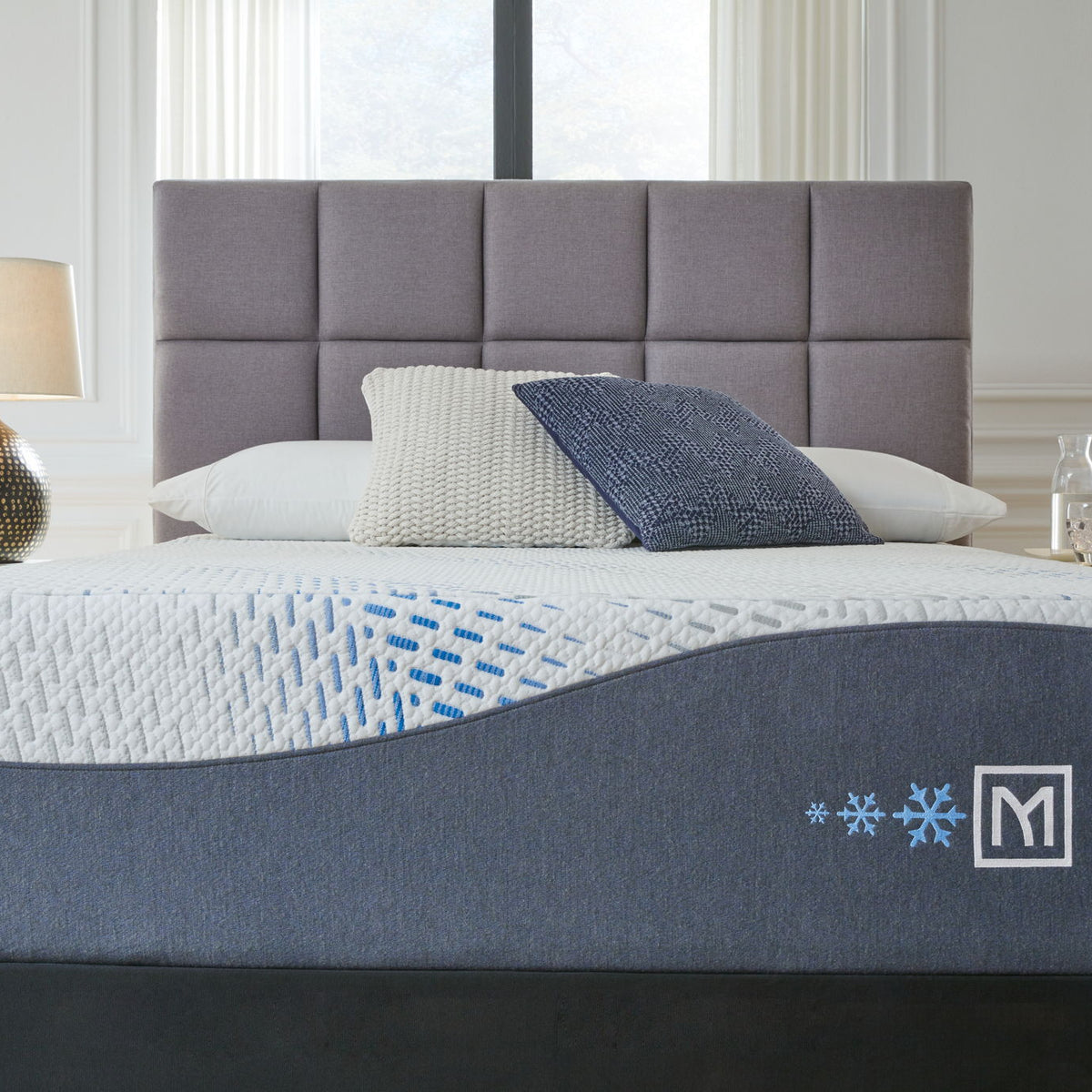 Dark gray upholstered mattress with white gel top, light blue pattern, Millennium logo