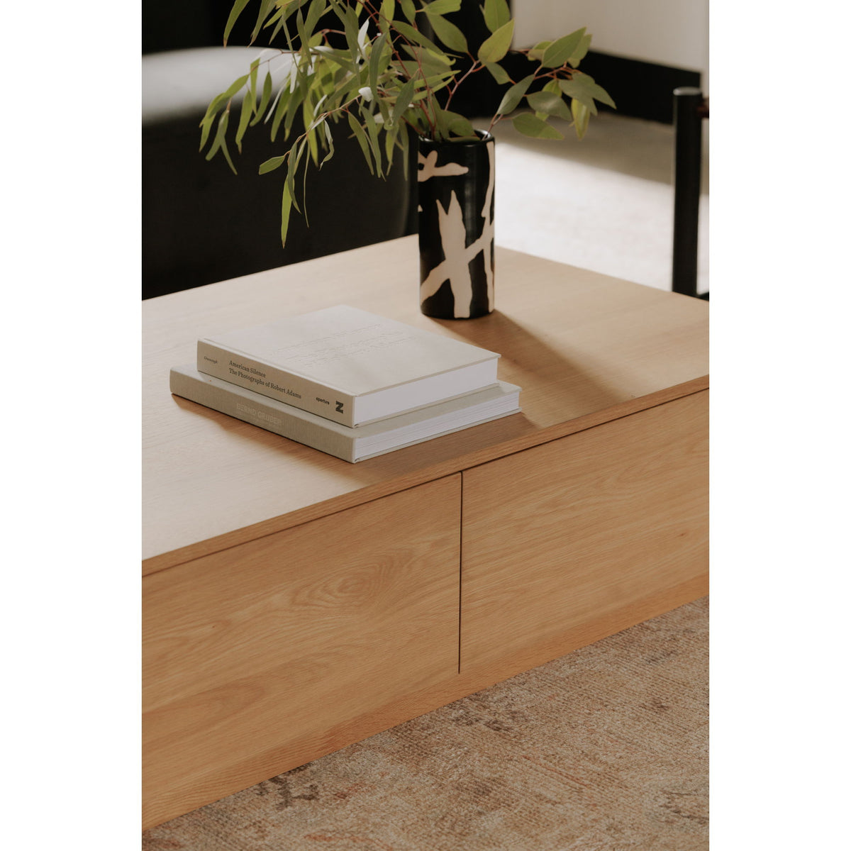 Oak coffee table with two smooth drawer fronts and clean corner lines