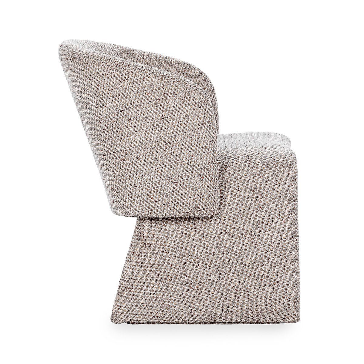 Upholstered dining chair in speckled beige fabric, angled side profile