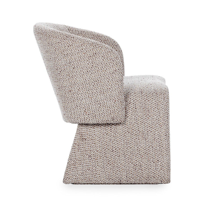 Upholstered dining chair in speckled beige fabric, angled side profile