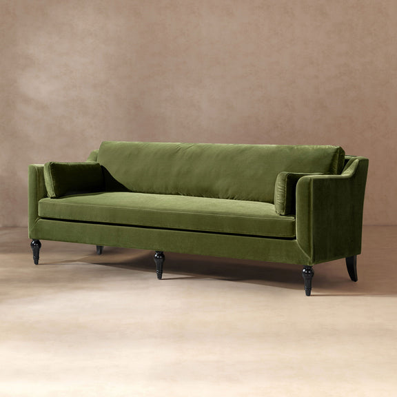 Olive green upholstered modern sofa with squared arms, bolster cushions, and tapered legs