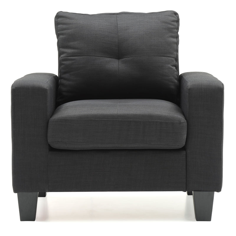 Dark gray upholstered accent chair with tufted high back and padded armrests