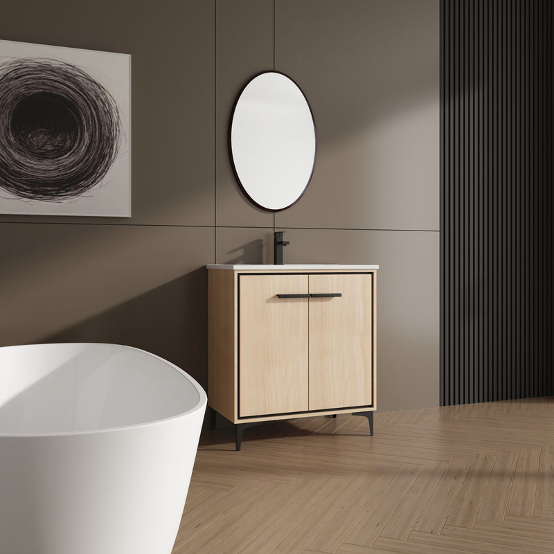 Light brown bathroom vanity cabinet with white sink, black bar handle, two doors