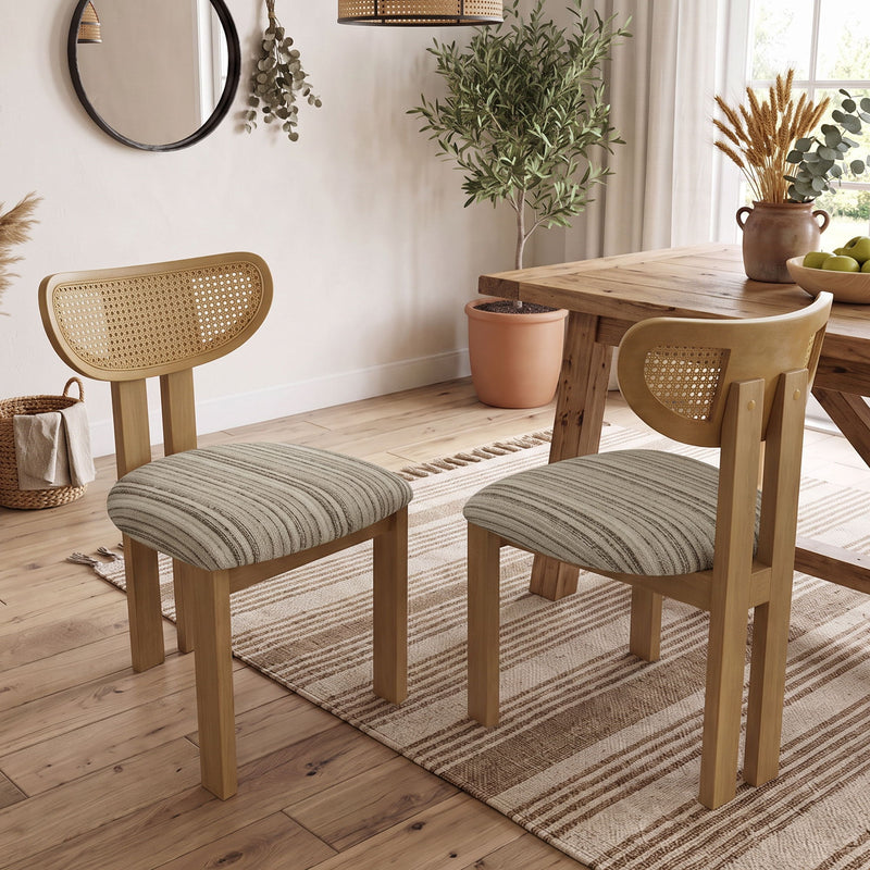 Pair of dining chairs with striped gray seats, light wood frames, and woven rattan backs