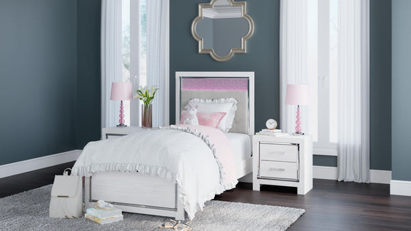White panel bed styled in a room with tufted gray headboard and soft bedding