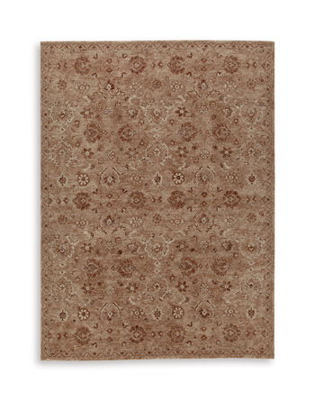 Light brown rectangular rug with ornate floral and medallion pattern