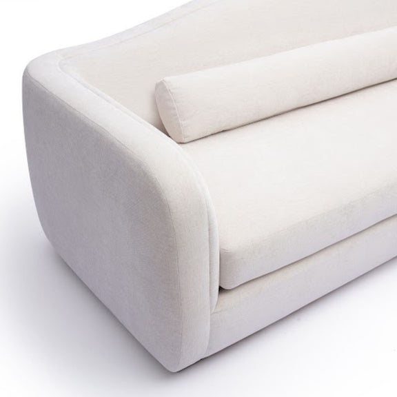 White fabric sofa arm and seat cushion with rounded edges and seam stitching