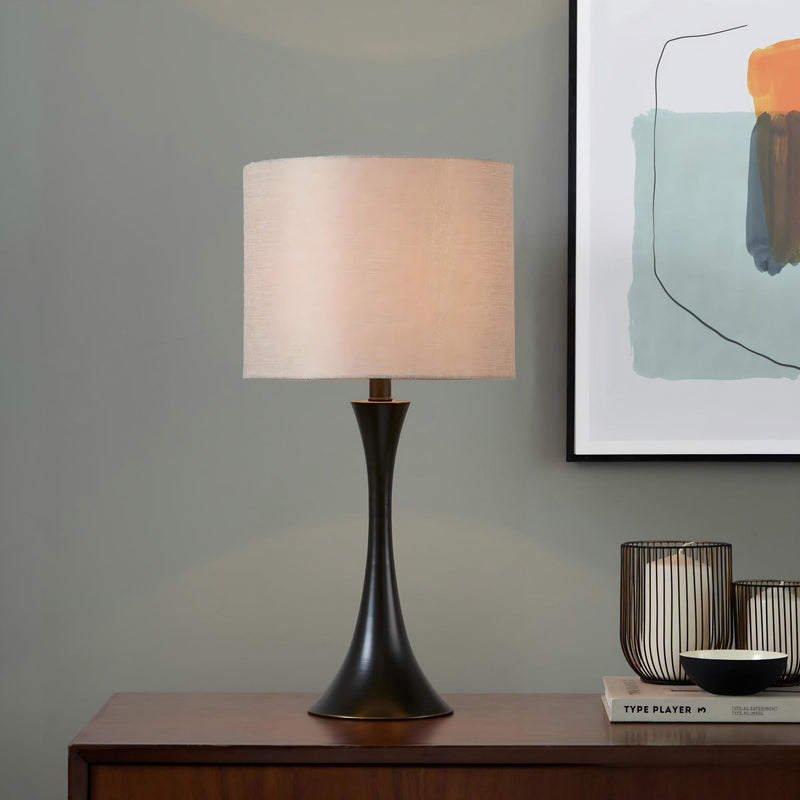 Black table lamp with beige fabric drum shade