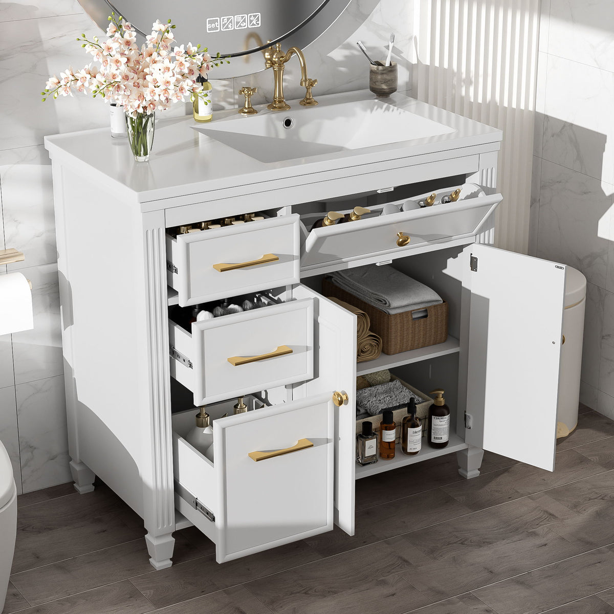 White bathroom vanity with sink; open shelving and drawers with gold bar pulls