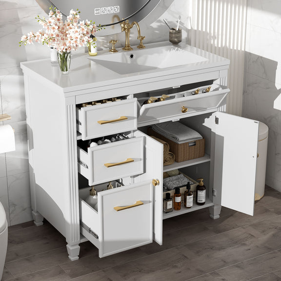 White bathroom vanity with sink; open shelving and drawers with gold bar pulls