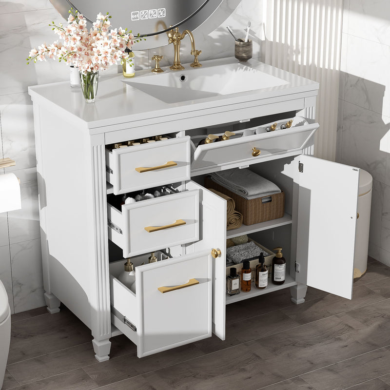 White bathroom vanity with sink; open shelving and drawers with gold bar pulls