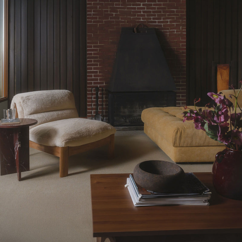 Faux fur accent chair with tufted look, curved arms, dark-stained wooden legs