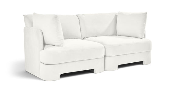 White velvet upholstered 2-piece loveseat with two seat sections and back cushions
