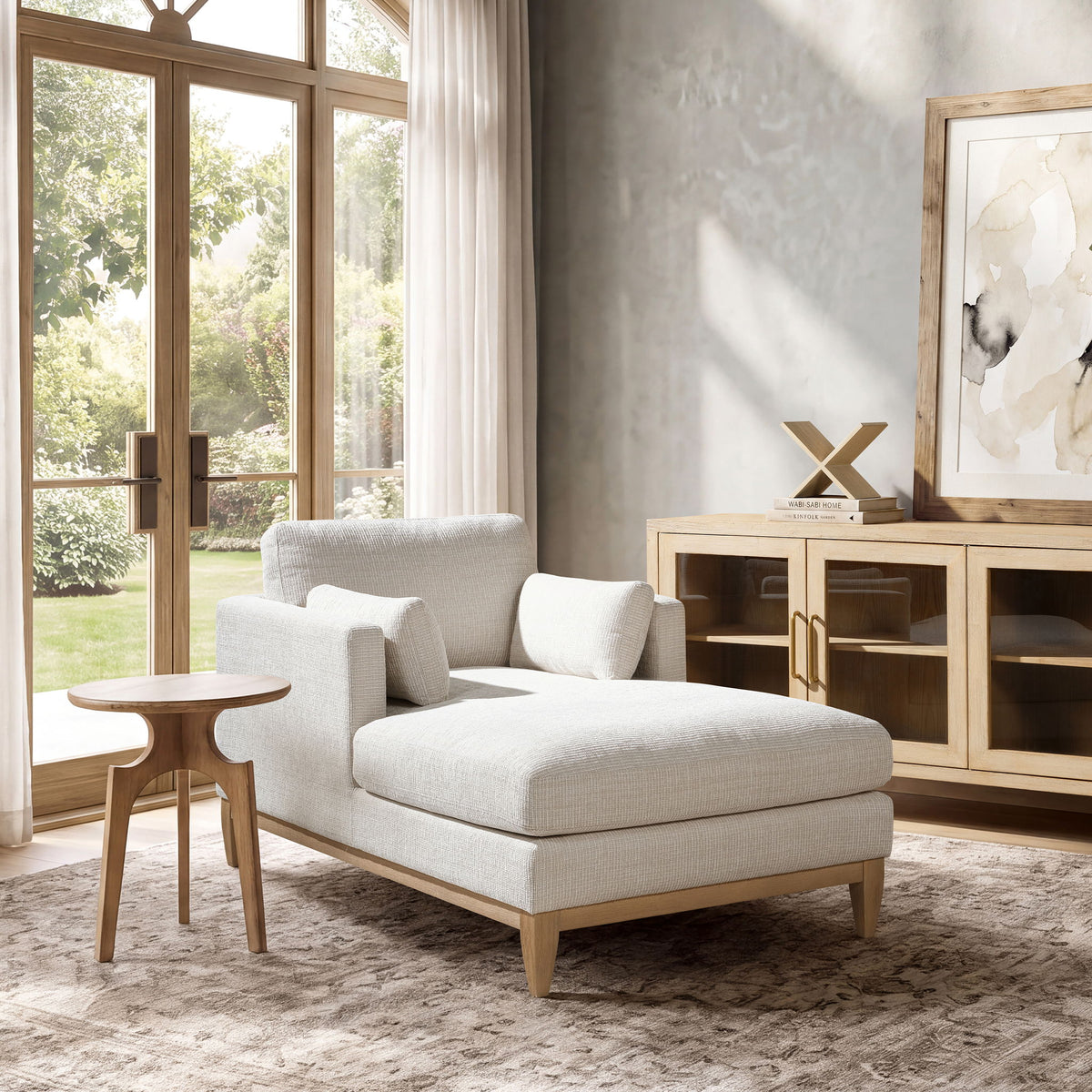 Light beige fabric chaise lounge chair with square back cushions and arm pillows