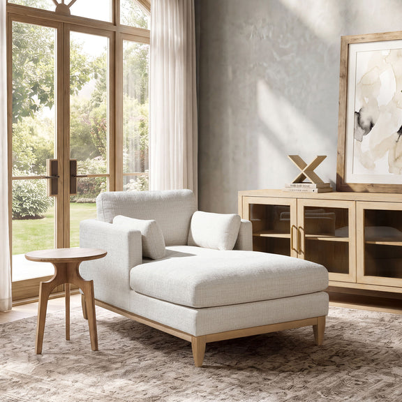 Light beige fabric chaise lounge chair with square back cushions and arm pillows
