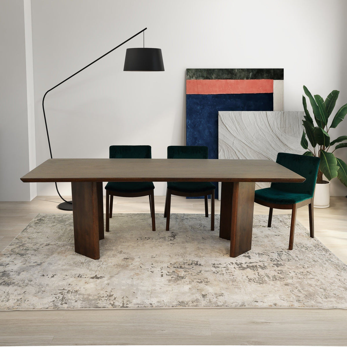 Dark oak dining table with four teal upholstered chairs, centered front view