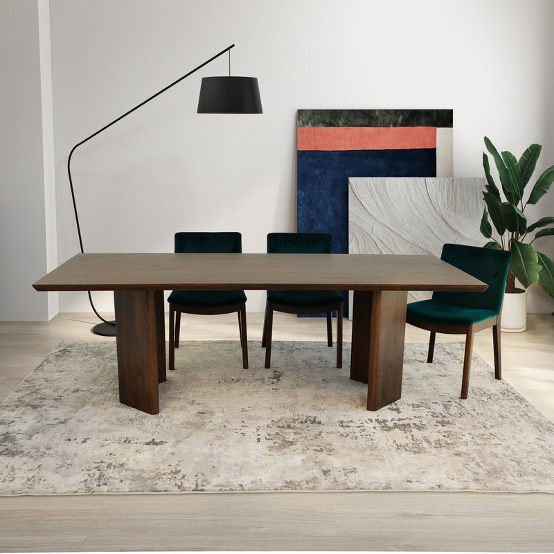 Dark oak dining table with four teal upholstered chairs, centered front view