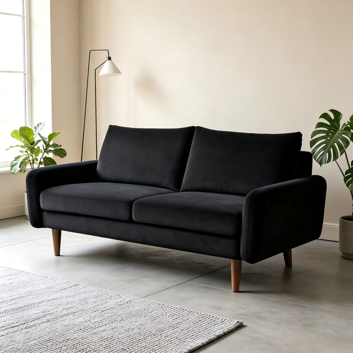 Black 2-seat loveseat sofa with two back pillows, square arms, and tapered wooden legs