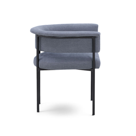 Blue upholstered dining chair, angled view with curved backrest and black frame