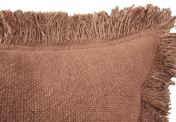 Brown square throw pillow close-up showing woven fabric and long fringe