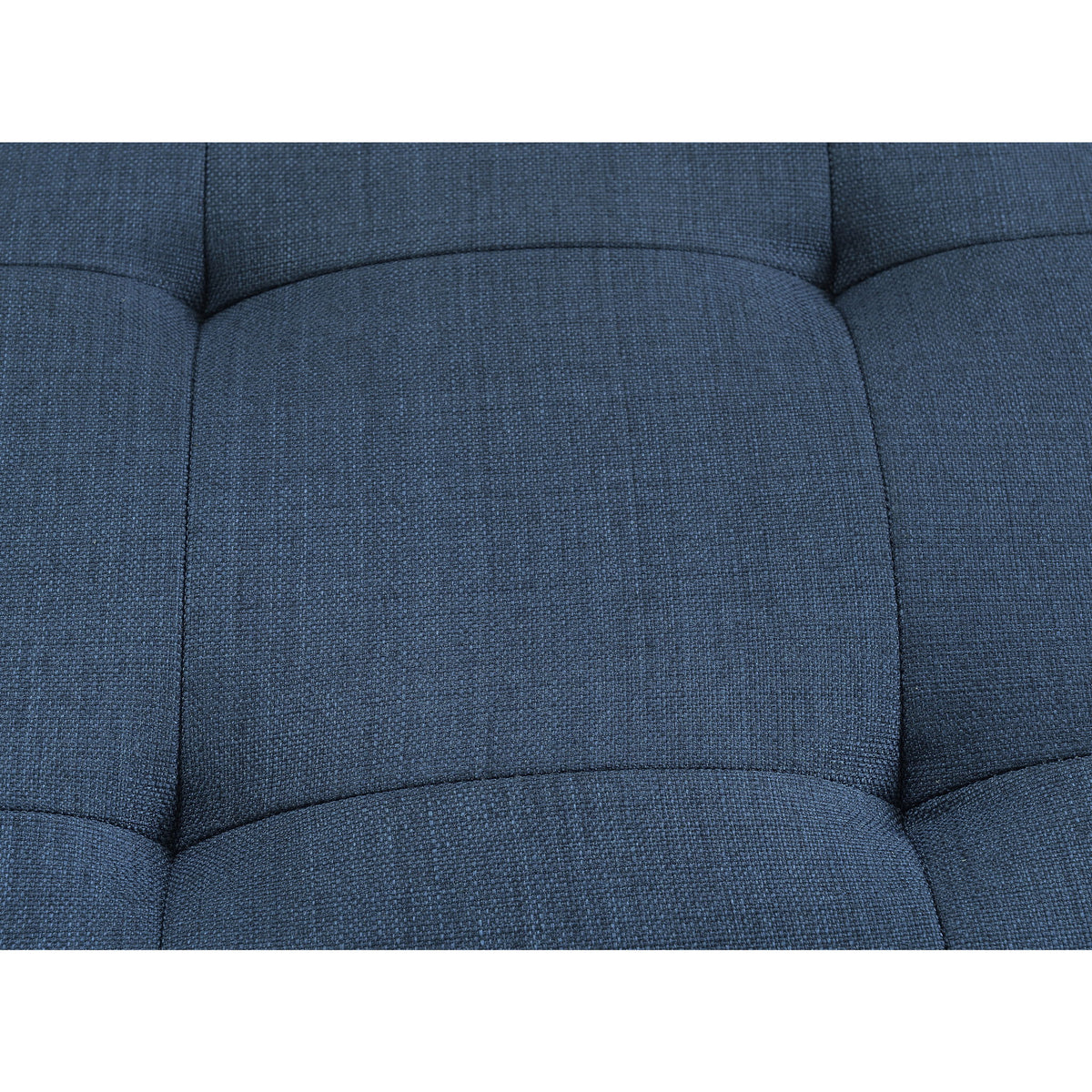 Close-up of blue upholstered loveseat back cushions with tufted trim and seams.