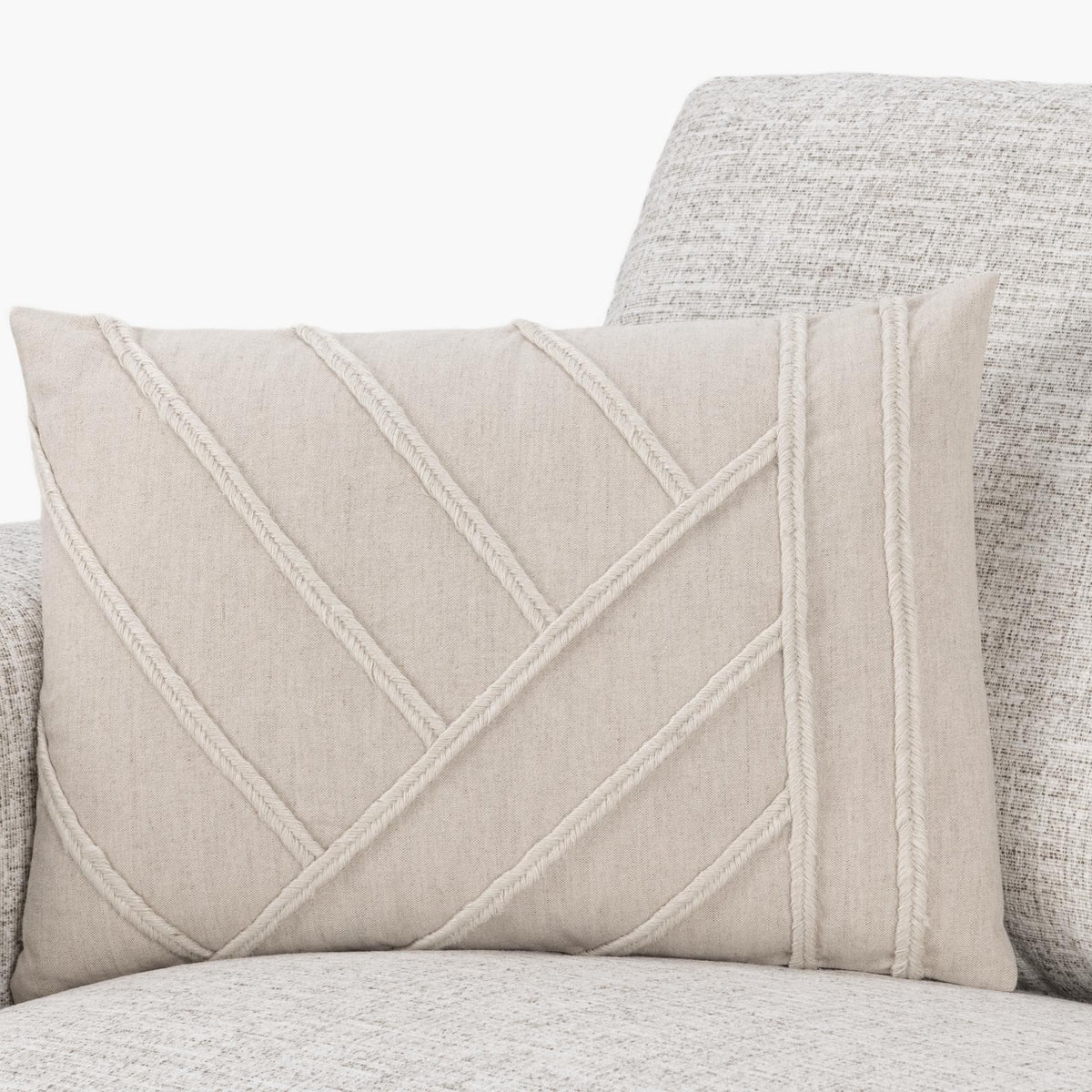Langdon pillow with natural fabric and diagonal stitched lines plus raised stripe trim