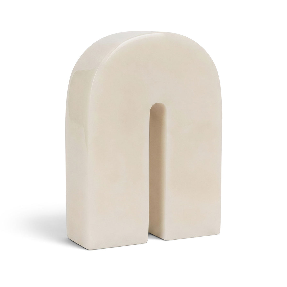 Ivory white marble bookend with arched cutout, smooth stone finish
