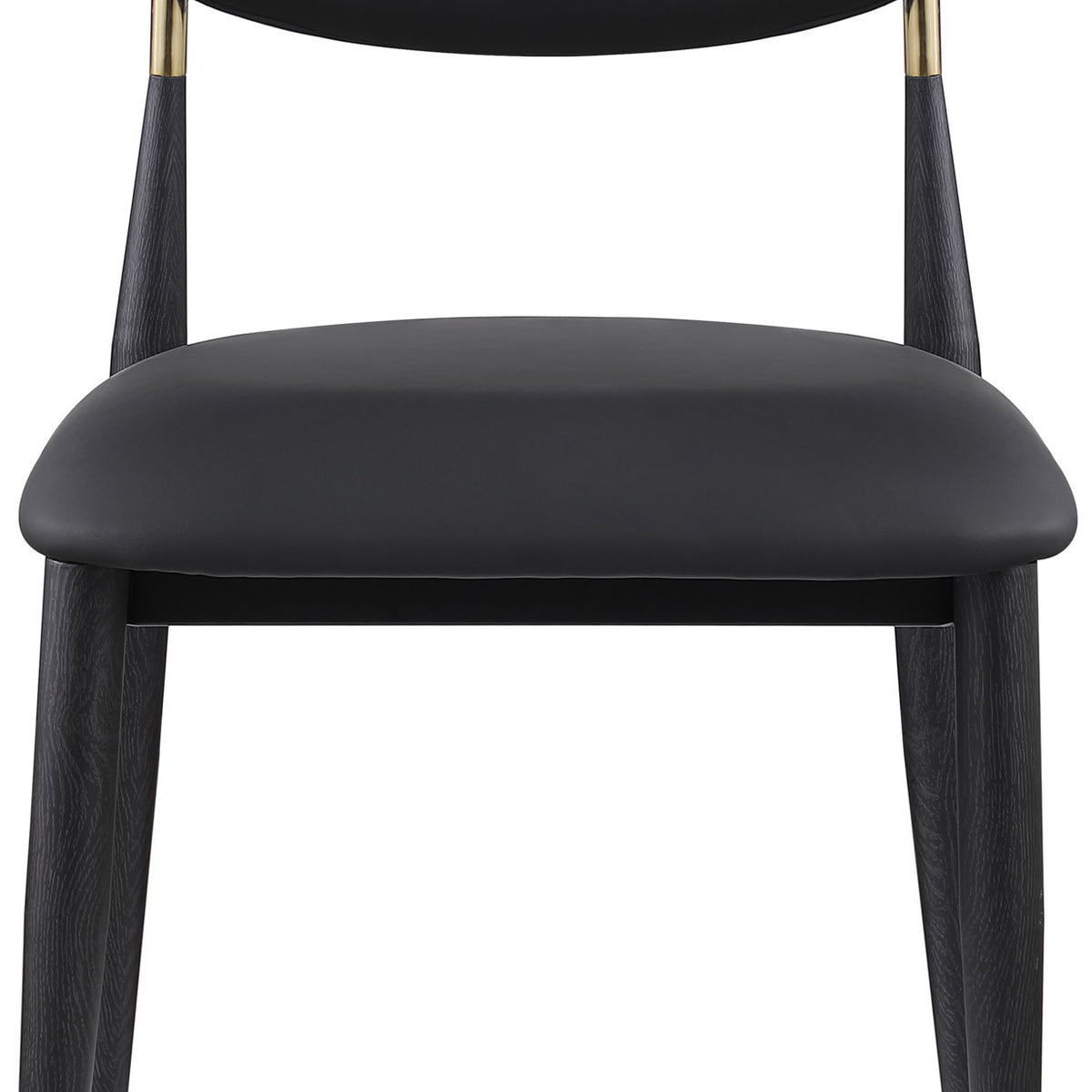 Black vegan leather dining side chair with rounded back and seat, black legs with gold tips