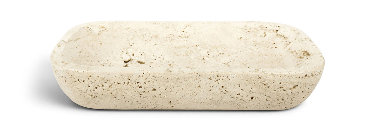 Beige travertine tray, rounded rectangular slab with speckled stone texture.