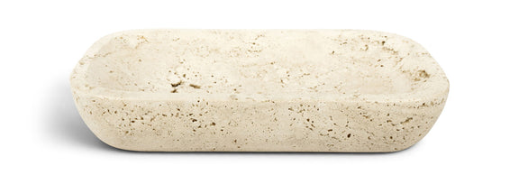 Beige travertine tray, rounded rectangular slab with speckled stone texture.