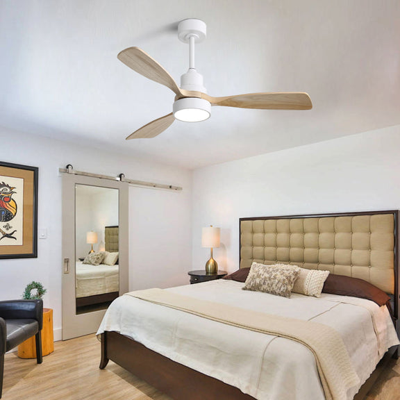 White indoor ceiling fan with four reversible wood blades and light fixture