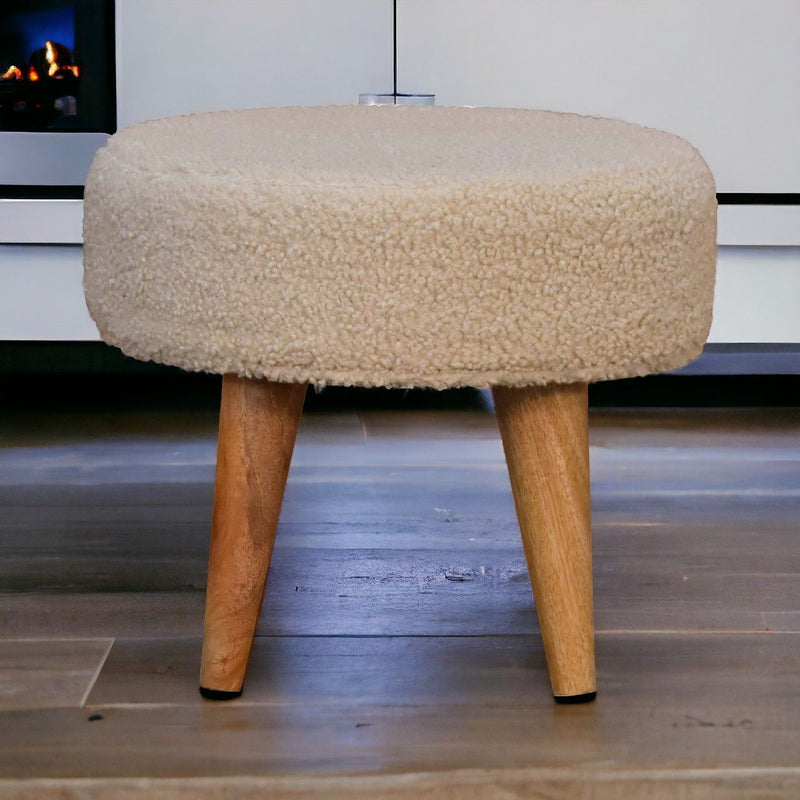 Cream boucle petite footstool with round top and four wooden legs