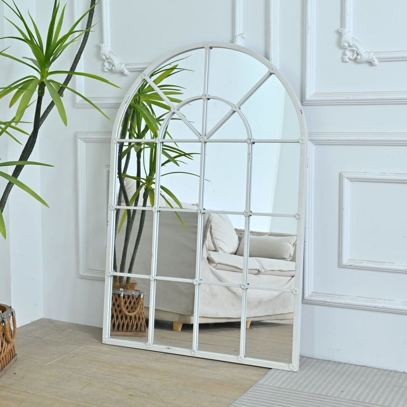White arched window-style mirror frame with grid panes, standing design