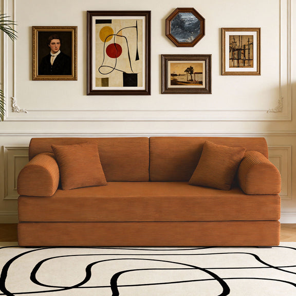 Orange convertible sleeper sofa bed in living room with three seat cushions.