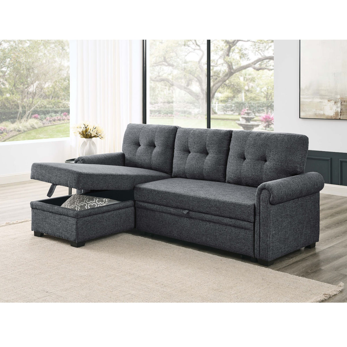 Dark gray tufted sleeper sectional with reversible storage chaise and chaise extension