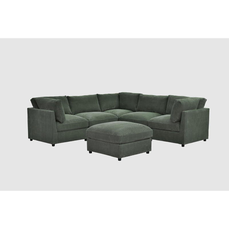 Dark green sectional sofa with ottoman bench seat and tufted back cushions
