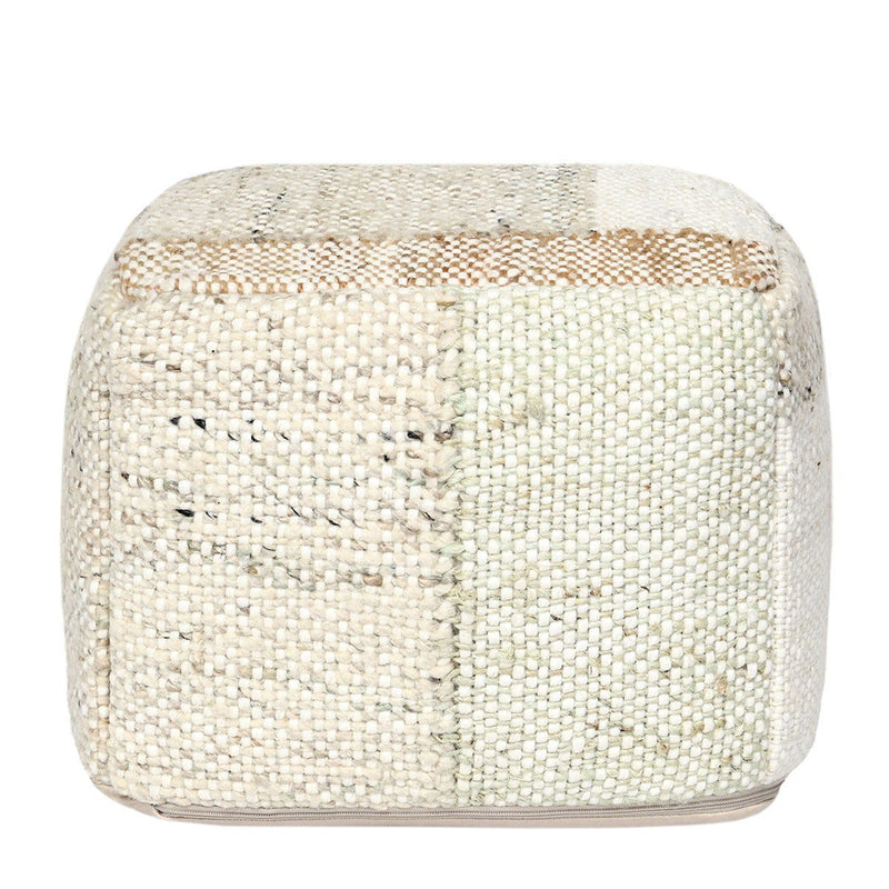 Round ottoman pouf in light woven boucle fabric with subtle blue and tan pattern