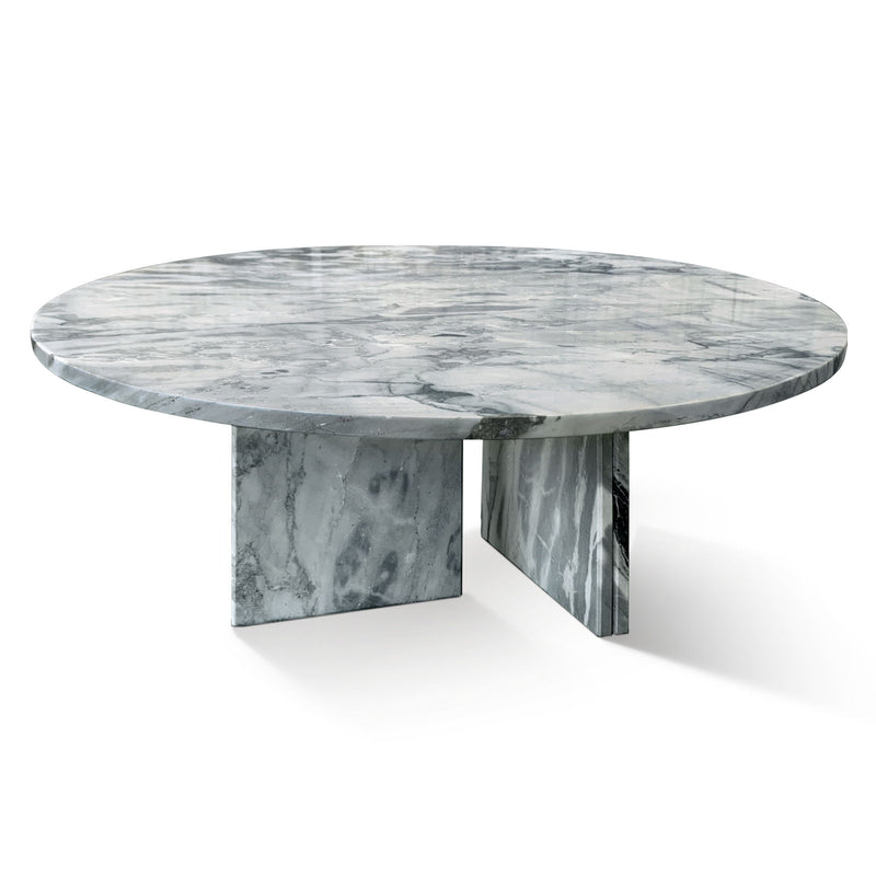 Round gray stone coffee table with marbled pattern and angled pedestal-style base
