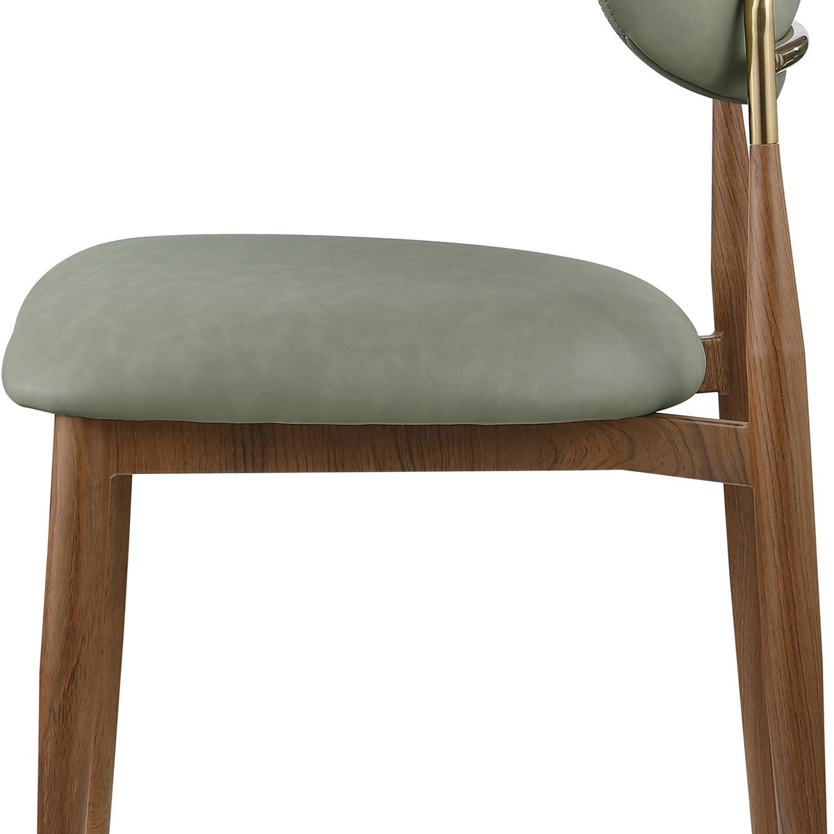 Green vegan leather dining side chair, close-up view with walnut legs