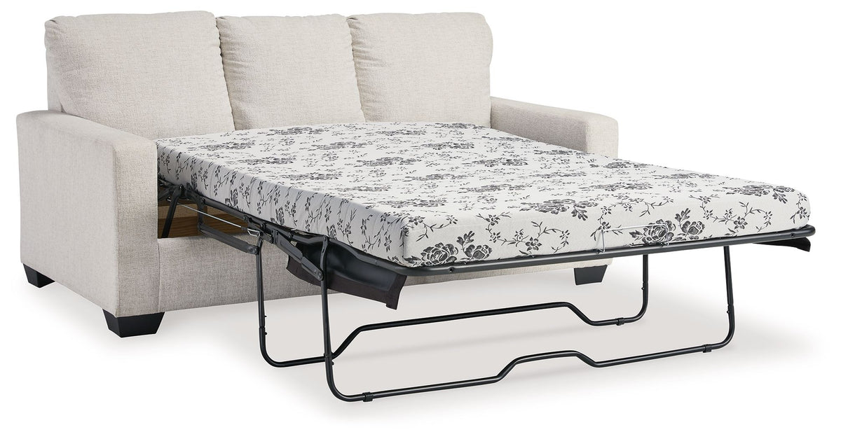 Light beige sofa with pull-out bed frame and white floral patterned mattress cover