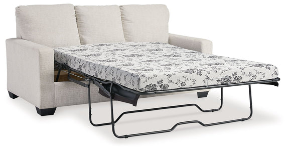 Light beige sofa with pull-out bed frame and white floral patterned mattress cover