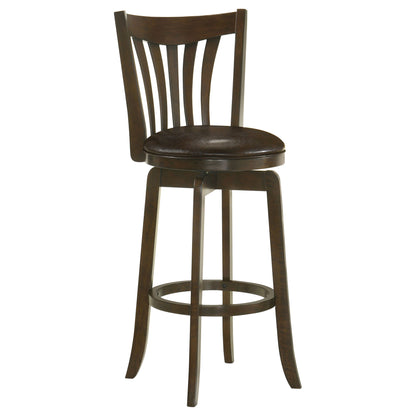 Dark brown swivel bar chair with round padded seat and vertical slat back