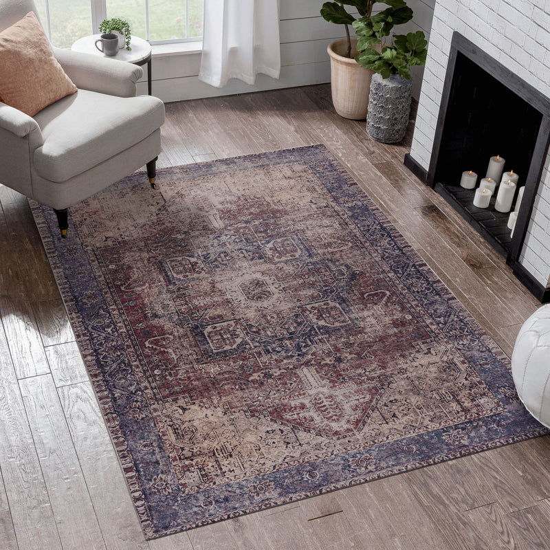 Dark red and blue distressed ornate area rug, rectangular with traditional pattern and border.