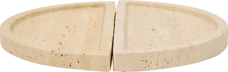 Beige travertine tray close-up with two semicircular halves separated by a seam.