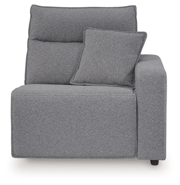 Salt-and-pepper gray upholstered recliner with padded back, side arms, and throw pillow