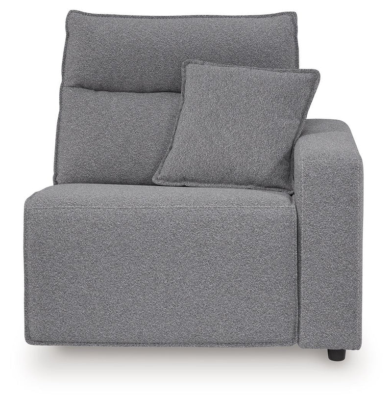 Salt-and-pepper gray upholstered recliner with padded back, side arms, and throw pillow