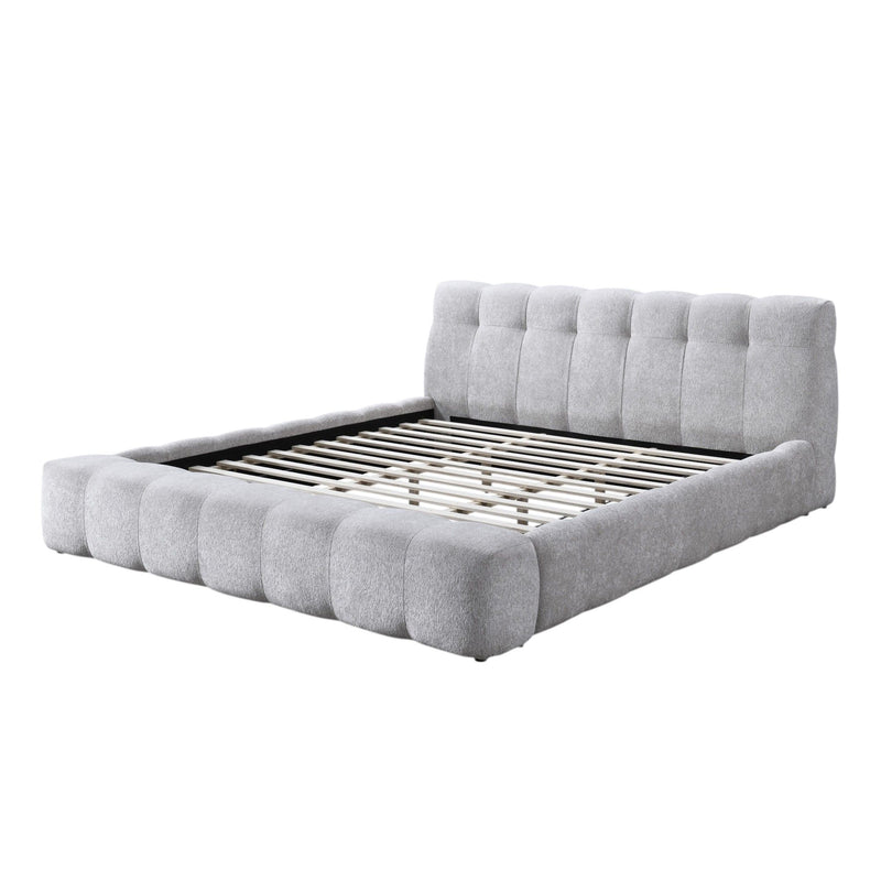 Gray upholstered Eastern king bed frame with tall headboard, padded rails, and slat support