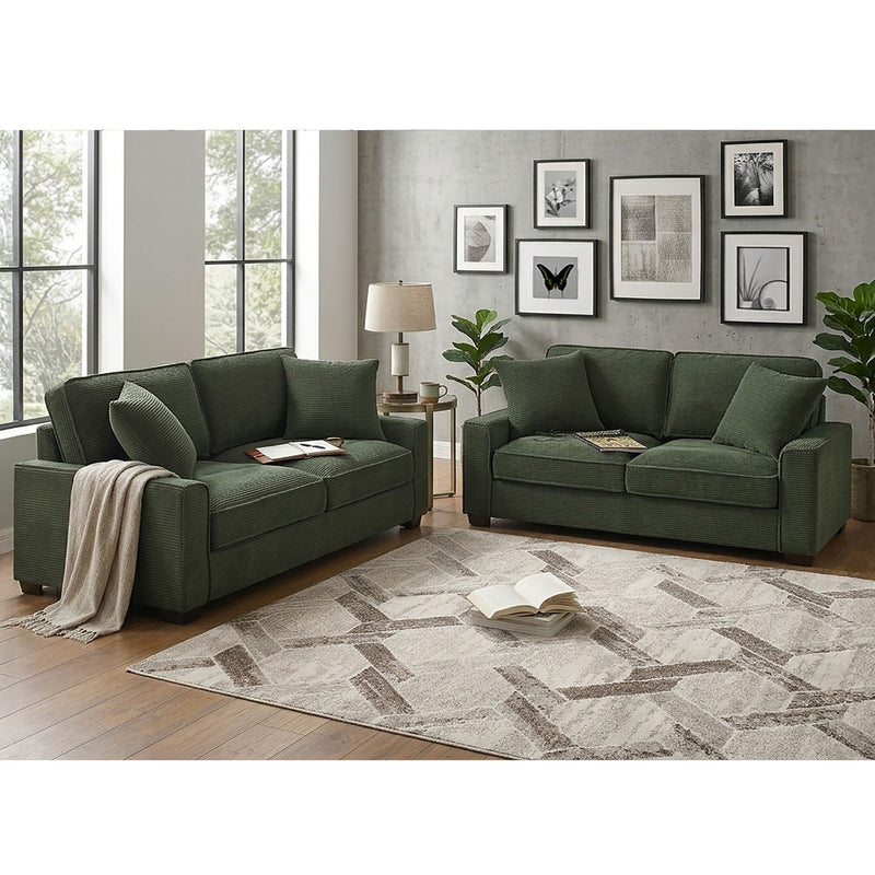 Forest green sofa and loveseat set with plush seat cushions and two accent pillows