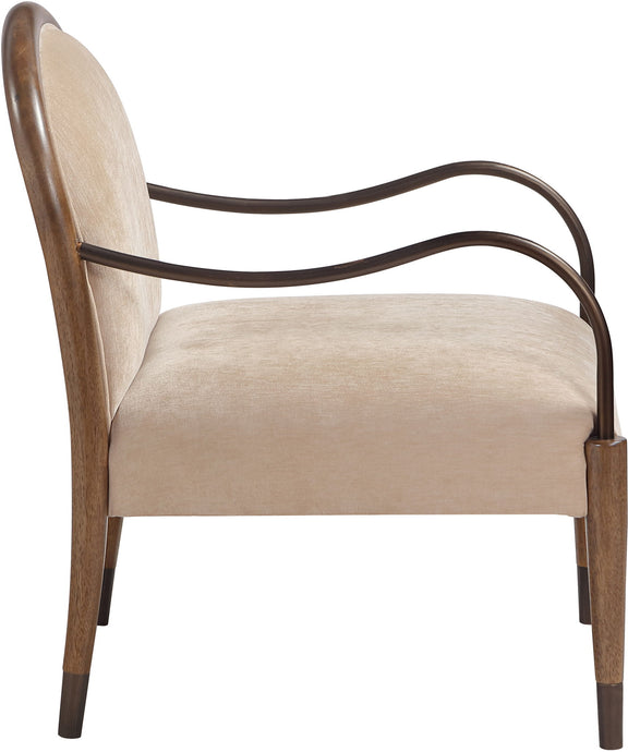 Beige fabric-upholstered accent chair side view with curved metal arms and wooden legs